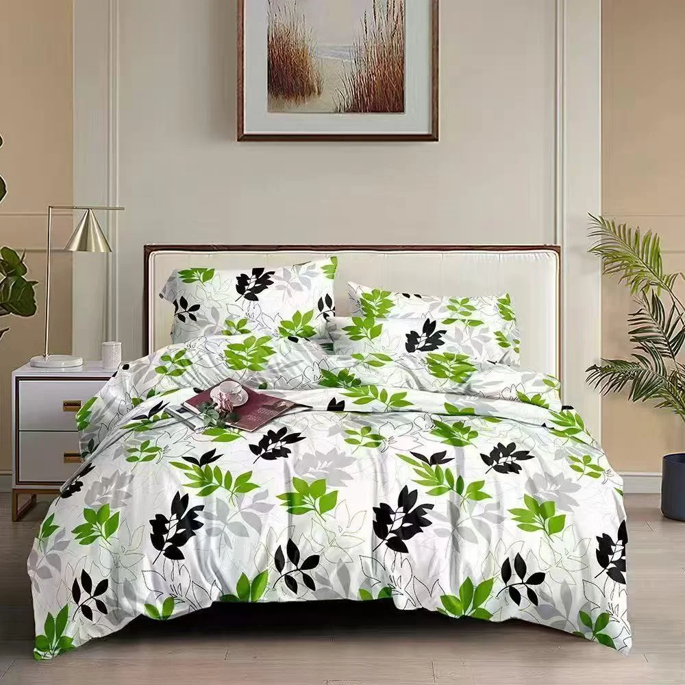 White and green floral bedding on a bed